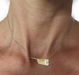 14Kt Gold Rowing Hatchet Necklace with Marquise Diamond by Rubini Jewelers, shown on woman's neck