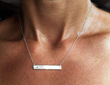 Silver Bar Necklace with Diamond by Rubini Jewelers, shown on neck