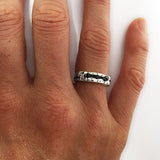 Silver Rocky Texture Ring with Sapphires, by Rubini Jewelers, shown on woman's hand