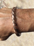 Handmade Twist Copper Cuff Bracelet by Rubini Jewelers, shown on man's wrist