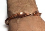 Men's Copper with Silver Twist Handmade Cuff Bracelet by Rubini Jewelers, shown on man's wrist
