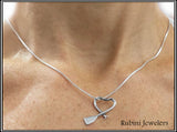 Petite Dragon Boat, Canoe, Paddle Board, SUP Paddle Freeform Heart Pendant by Rubini Jewelers, shown on 16 inch chain on woman's neck