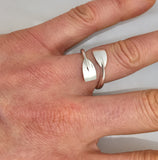 Sterling Silver Bypass Tulip Rowing Blades Adjustable Ring Shown on Hand by Rubini Jewelers