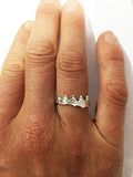Four person rowing boat with coxswain ring shown on hand, by Rubini Jewelers