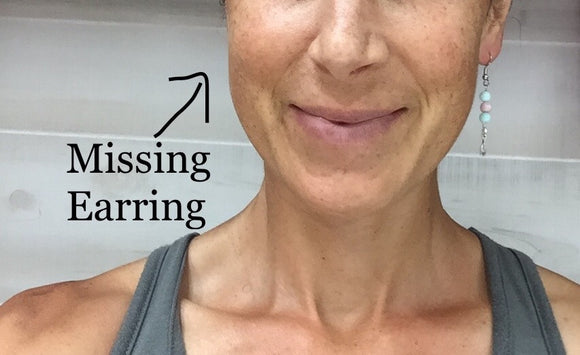 Woman Missing One Earring