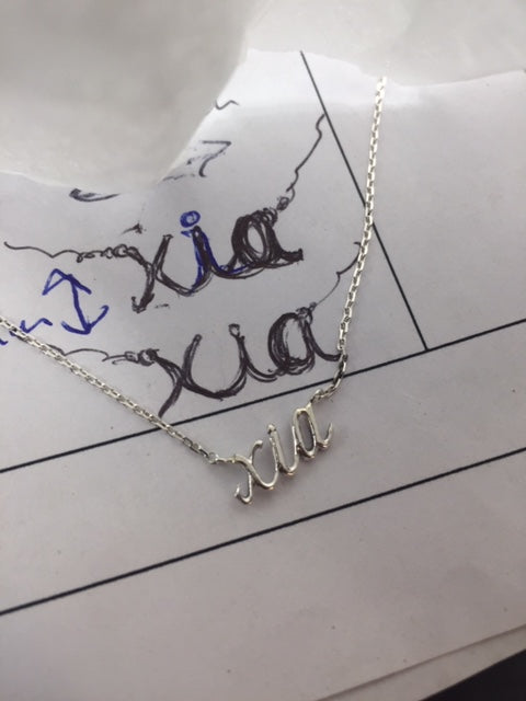 Custom sterling silver name necklace by Rubini Jewelers