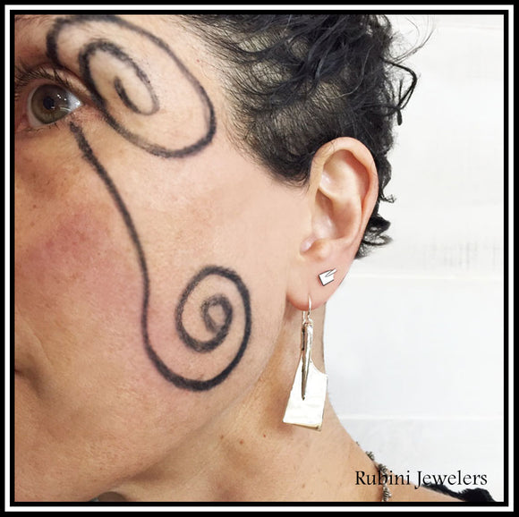 Rowing Earrings Made by Rubini Jewelers of Alexandria Virginia, shown on woman's ear 