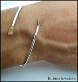 Brass & Sterling Silver Petite Oar Blades Bypass Cuff Rowing Bracelet by Rubini Jewelers shwon on rower's wrist