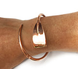 Copper Plated Extra Large Tulip Oar Wrap Rowing Bracelet, by Rubini Jewelers, shown on wrist