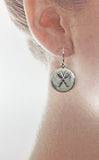 Sterling Silver Crossed Oars on Brushed Disc Wire Earrings by Rubini Jewelers