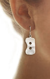 Sterling Silver Large Rowing Seat Pad Dangle Earrings by Rubini Jewelers, shown on ear