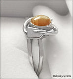 Ethiopian Opal in 14kt Bezel w/ Two Rowing Blades Ring by Rubini Jewelers