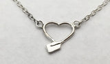 Tiny heart with hatchet oar rowing necklace sterling silver by Rubini Jewelers