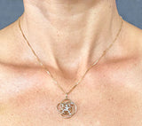 14Kt Gold Knot with Happy Rower-Paddler and Diamond Pendant by Rubini Jewelers