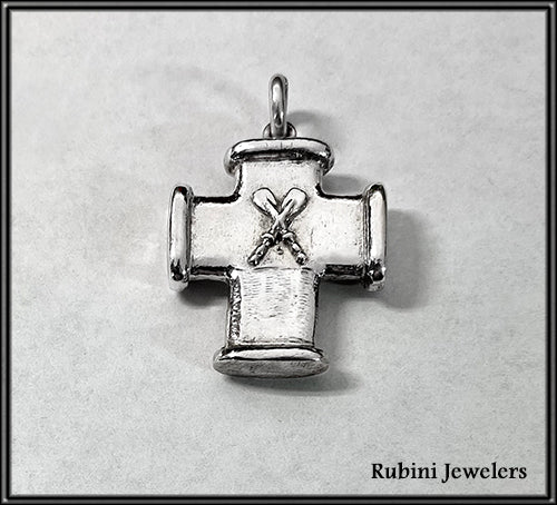Pendant: large rough texture cross w/ x'd oars by Rubini Jewelers