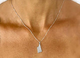Medium Hatchwt Blade Pendant on Chain Rowing Necklace by Rubini Jewelers, shown on woman's neck
