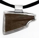 Pendant: carved leather blade bezeled in sterling silver, by Rubini Jewelers