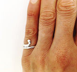 Petite Field Hockey Stick Wrap Ring in sterling silver, by Rubini Jewelers, shown on hand