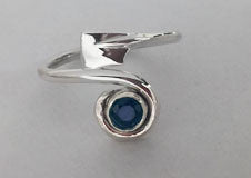 Sapphire in a Spiral with Hatchet Blade Rowing Ring by Rubini Jewelers