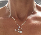 Silver River with Sapphire Rowing Pendant by Rubini Jewelers, shown on neck