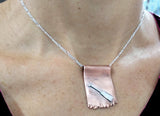 Dragon Boat Paddle on Copper Dragon's Claw Pendant, by Rubini Jewelers